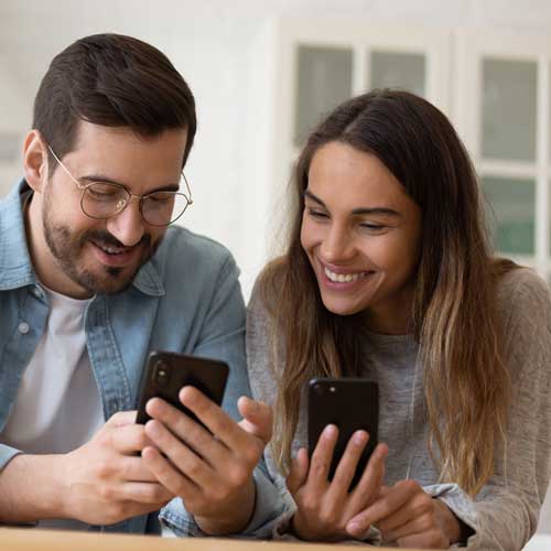couple looking at their cell phones together